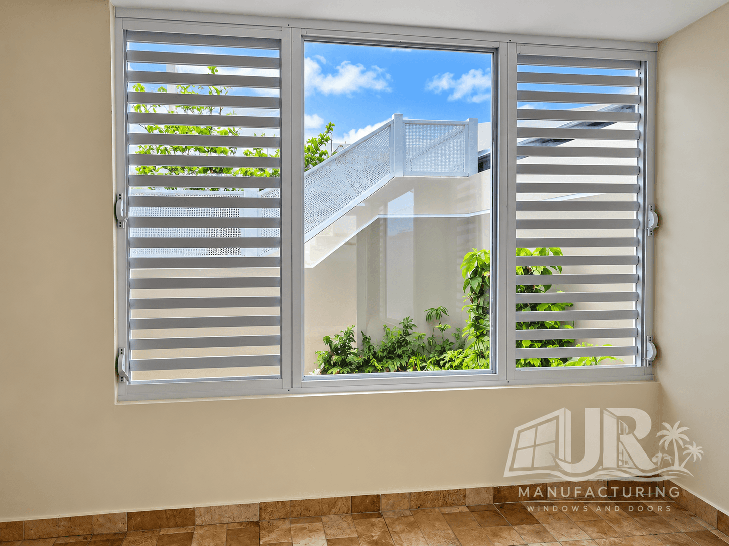 Three-panel window with white louvered shutters and a clear center pane showing outdoor stairs.